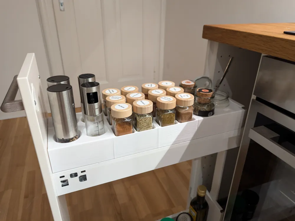 Modular spice organizer inserts installed in a narrow IKEA apothecary pull-out.